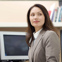 Woman in front of computer in office